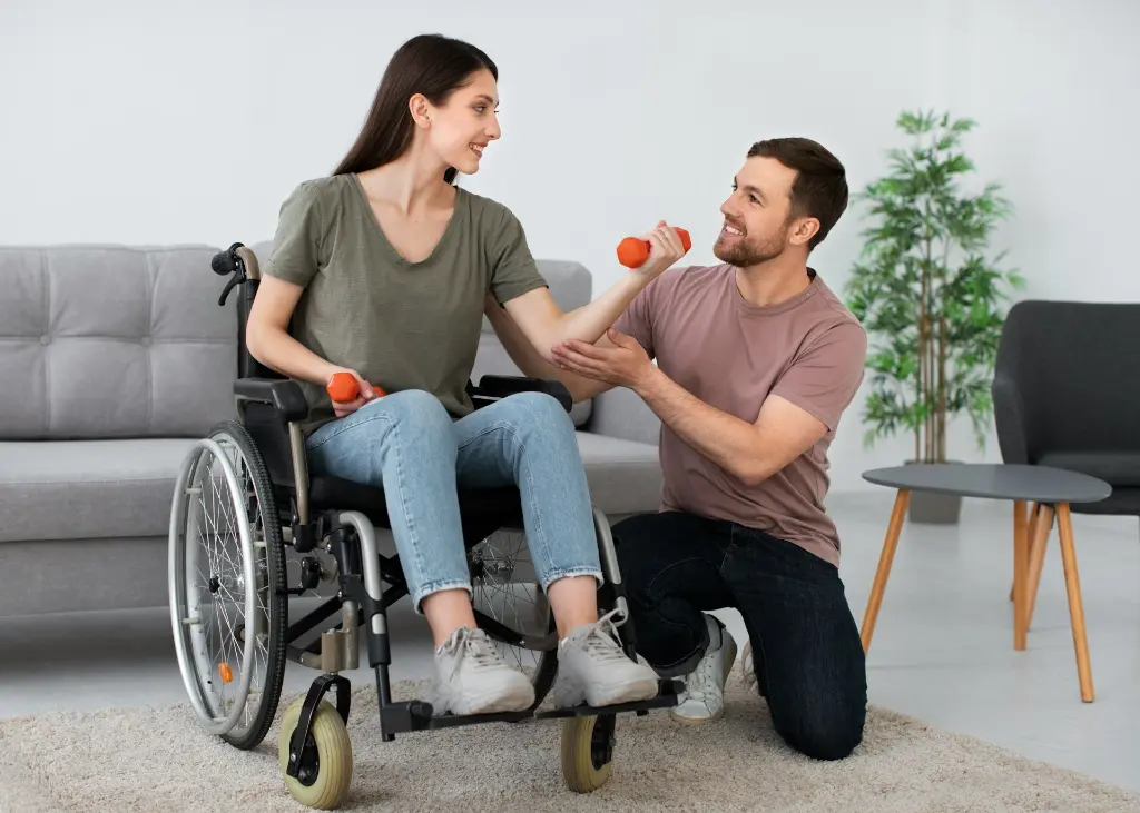 A man in a wheel chair being pushed by a woman